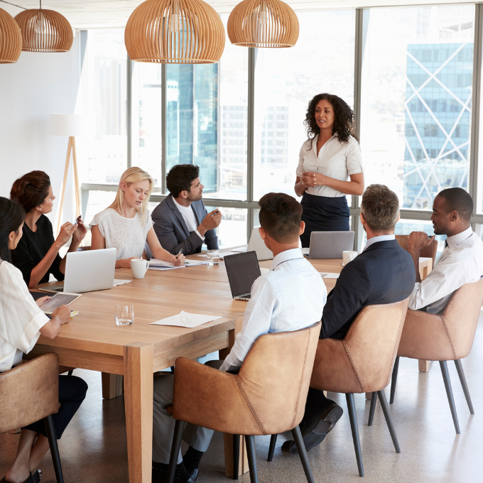 A meeting with a group of people around