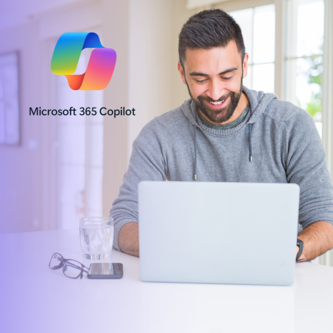Man smiling laptop Microsoft 365 Copilot logo